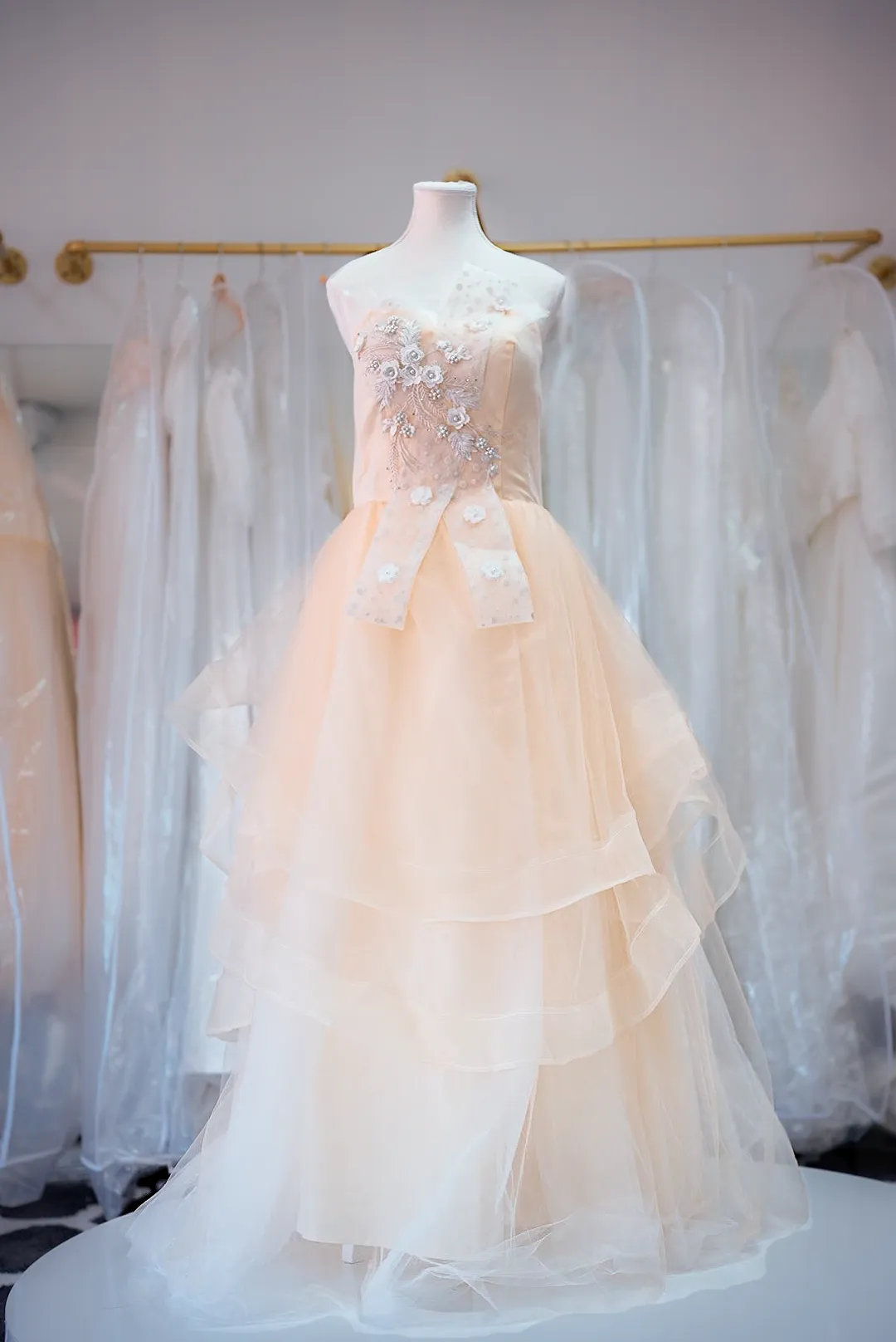 Peach tiered tulle wedding gown