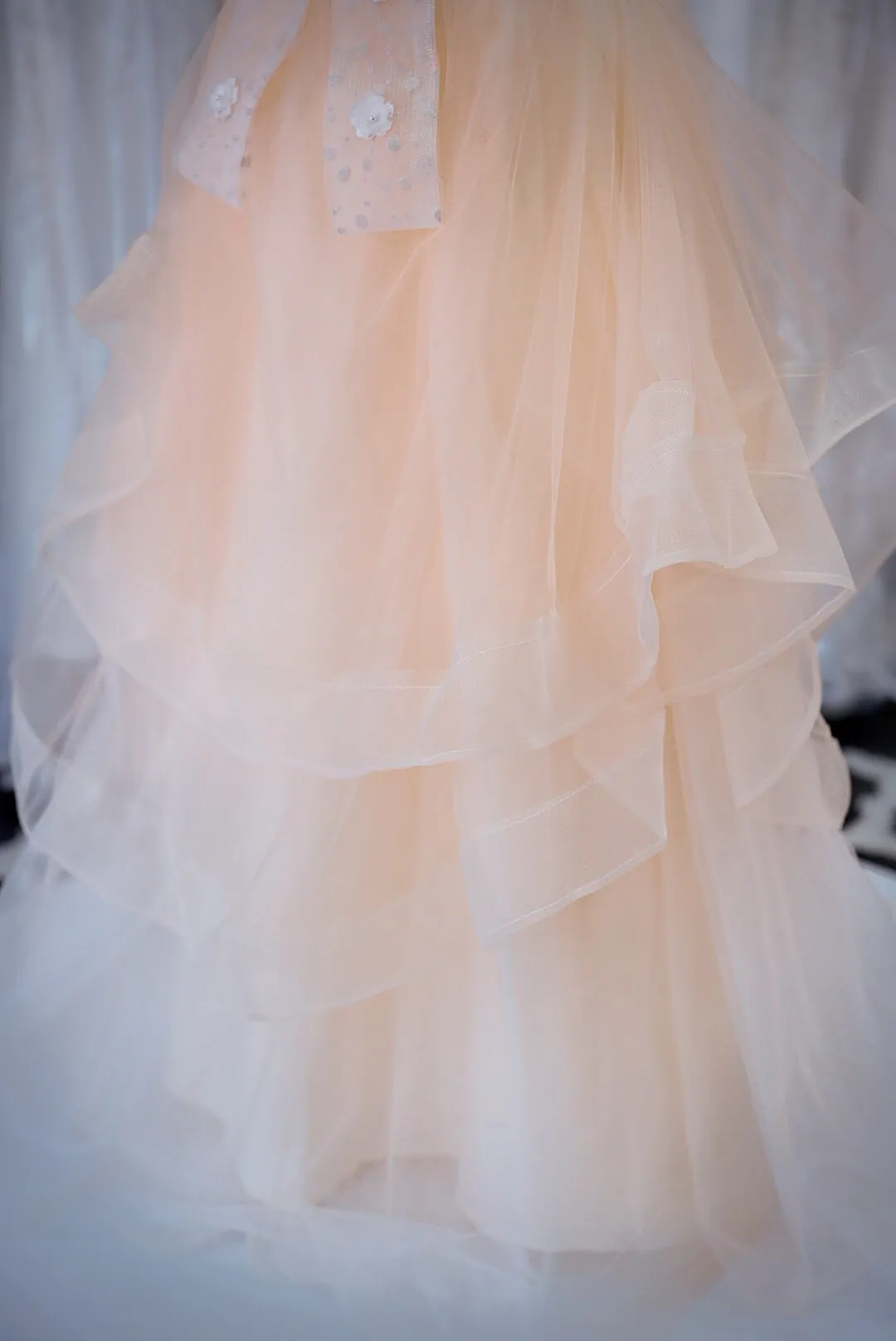 Peach tiered tulle wedding gown photo 2