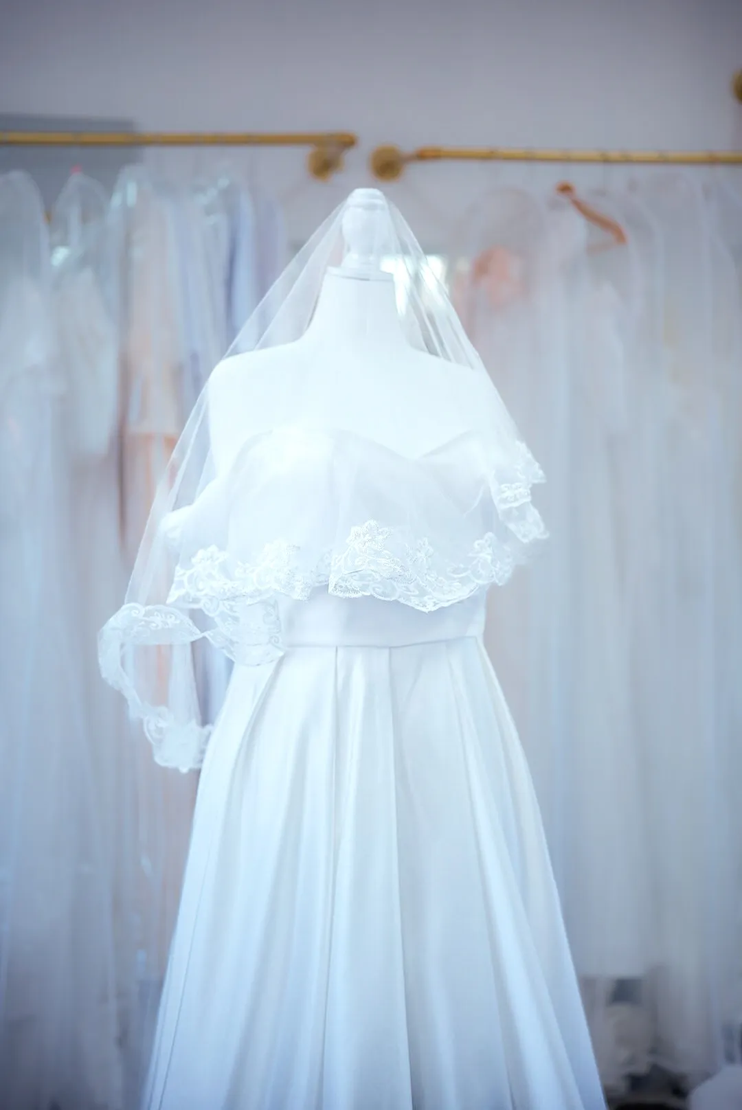 Ivory satin wedding dress with bow straps