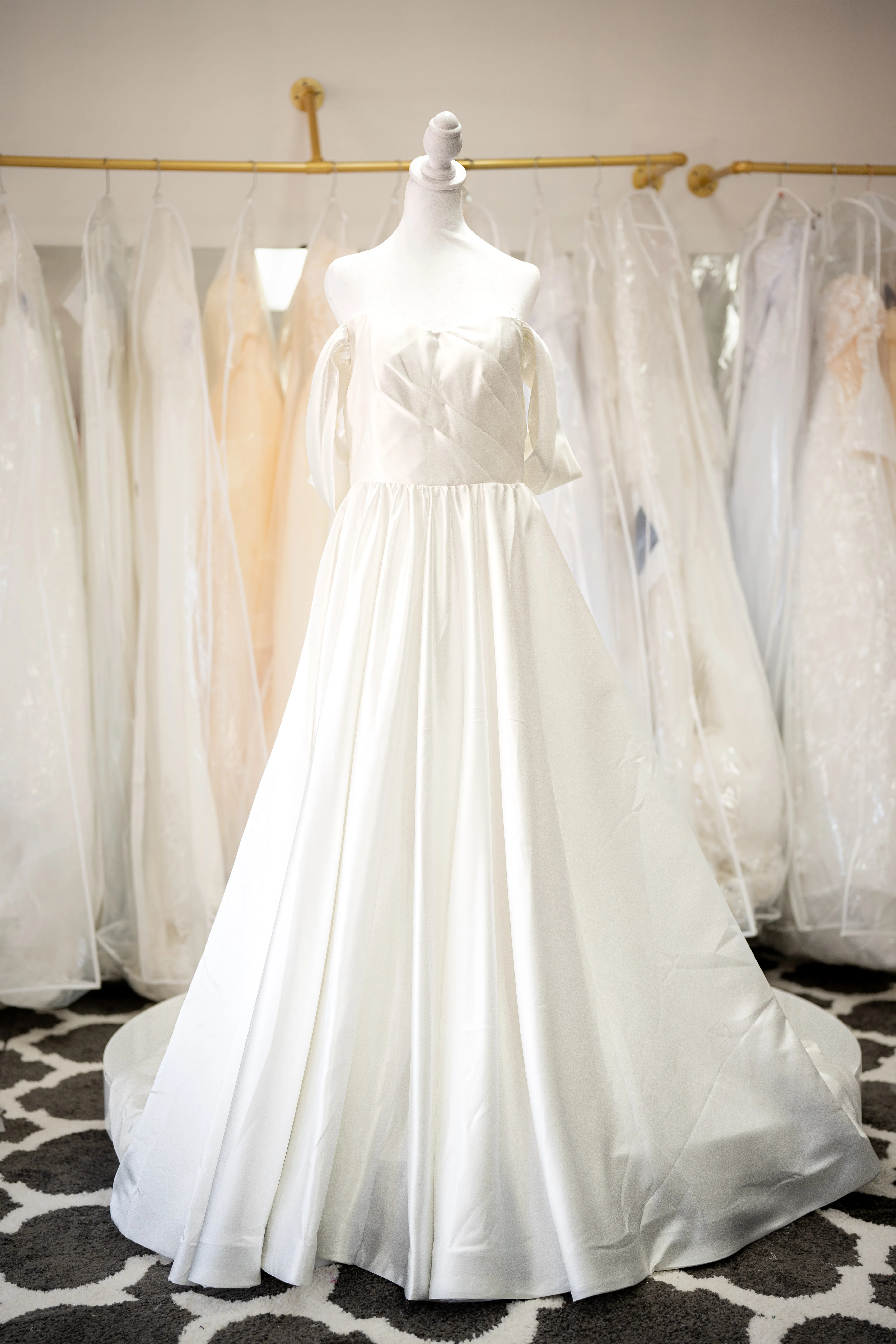 Ivory satin wedding dress with bow straps photo 7