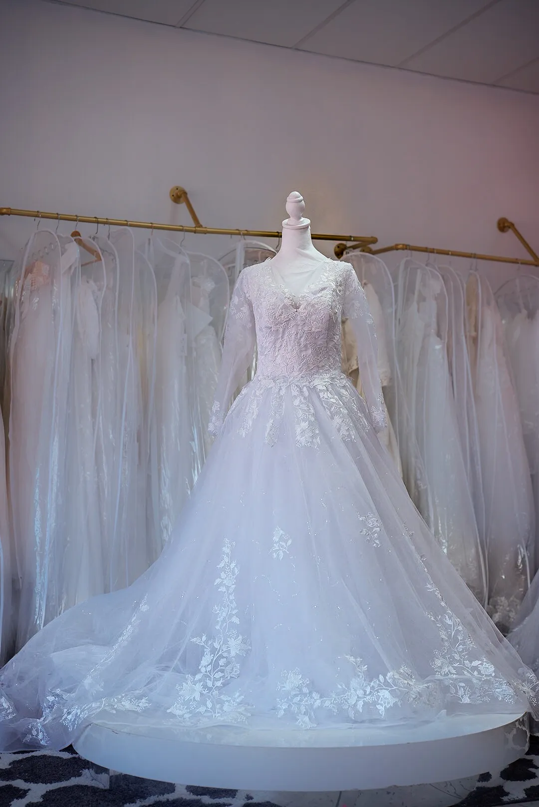 Blush lace wedding gown with sheer sleeves