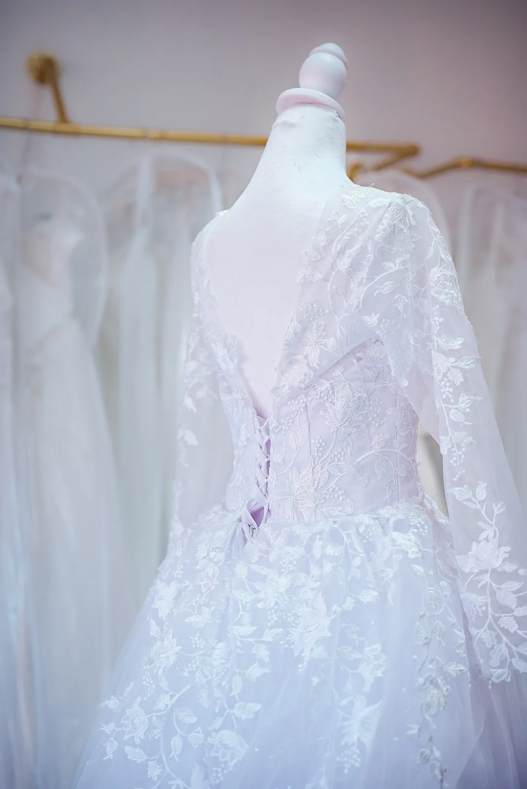 Blush lace wedding gown with sheer sleeves photo 2