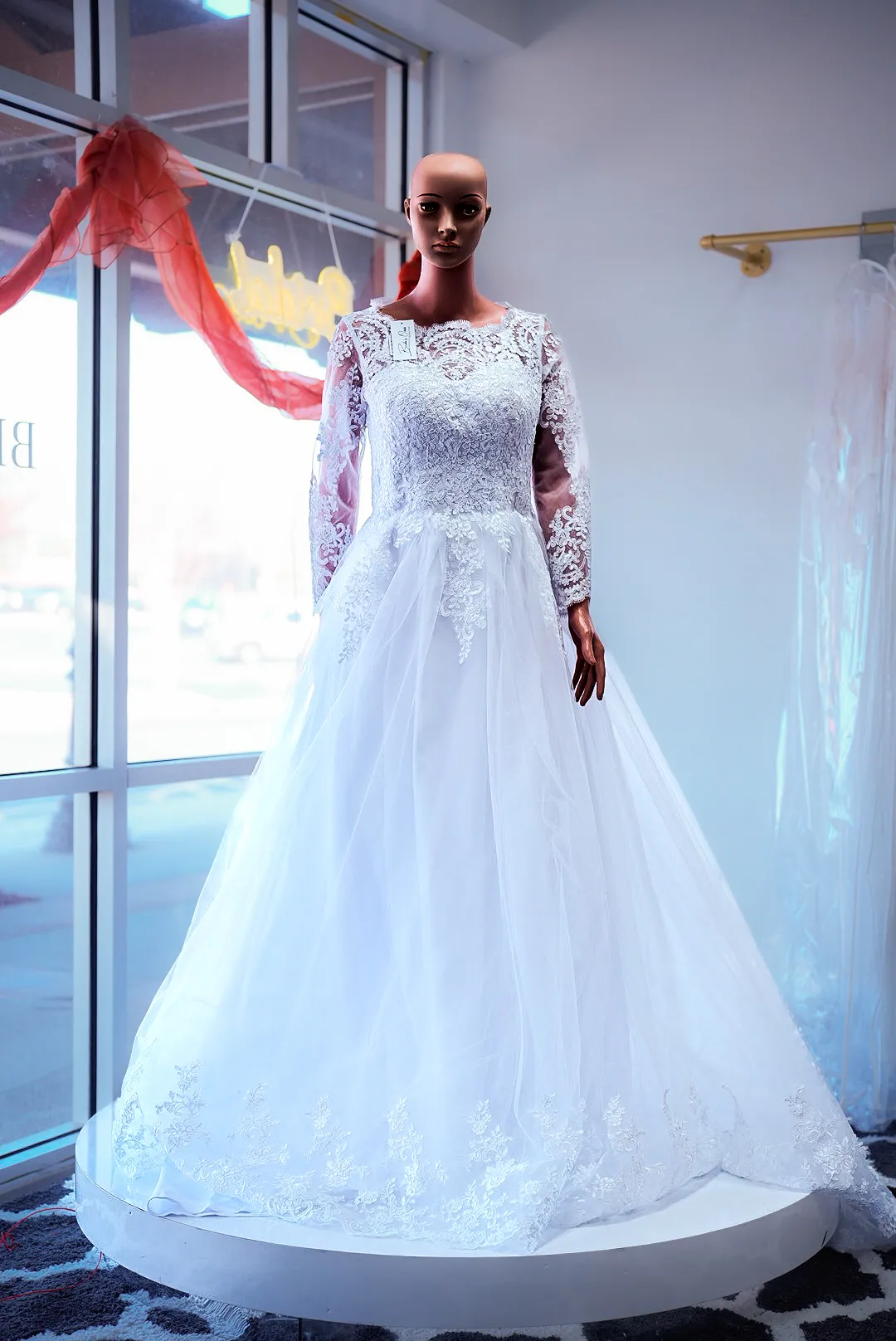 White illusion-sleeve lace wedding gown