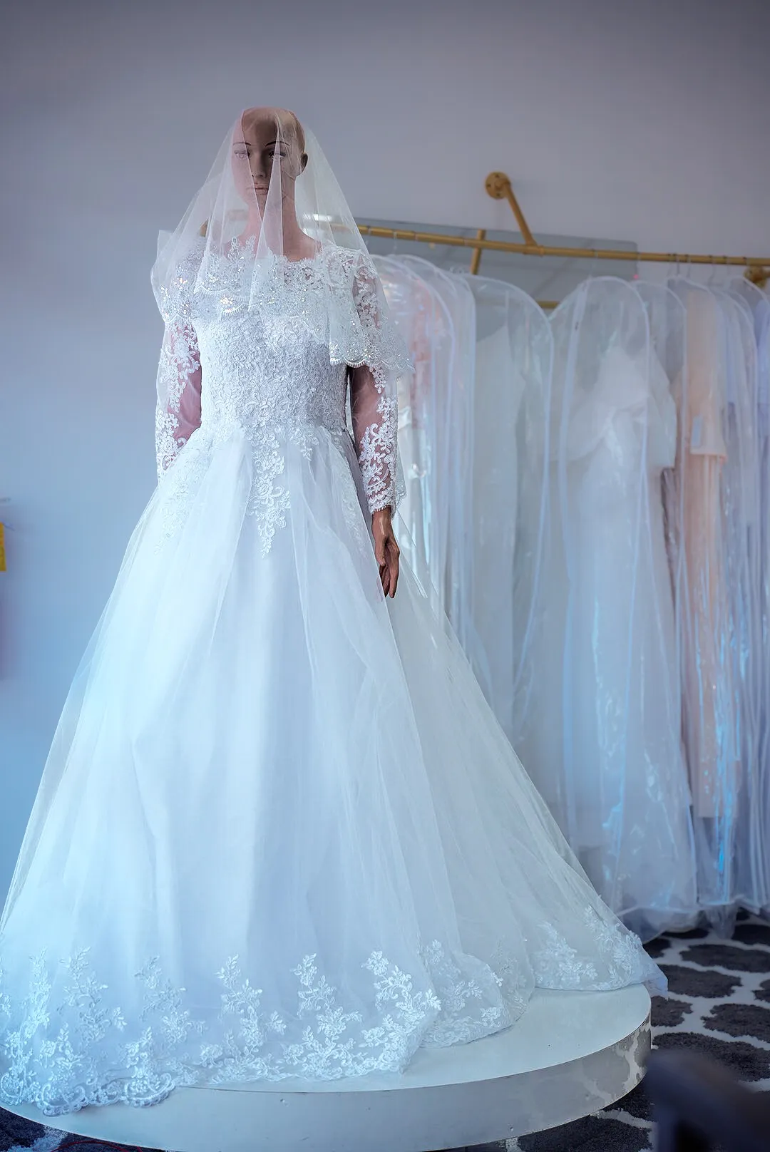 White illusion-sleeve lace wedding gown photo 2