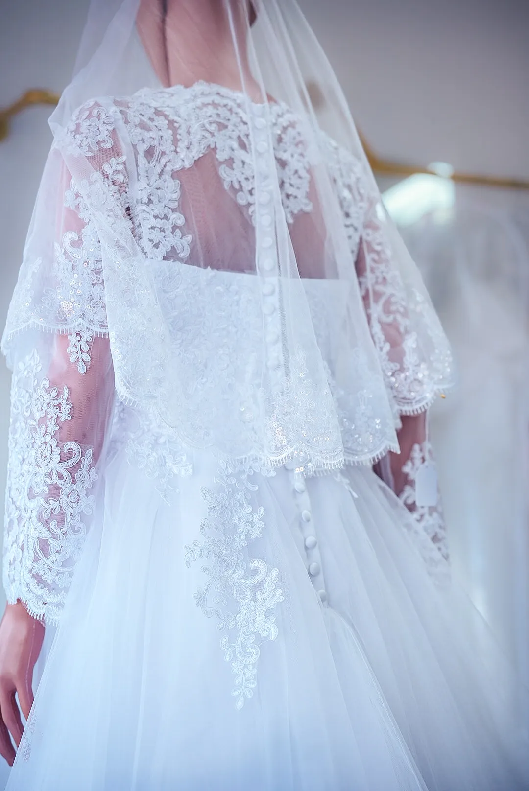 White illusion-sleeve lace wedding gown photo 4