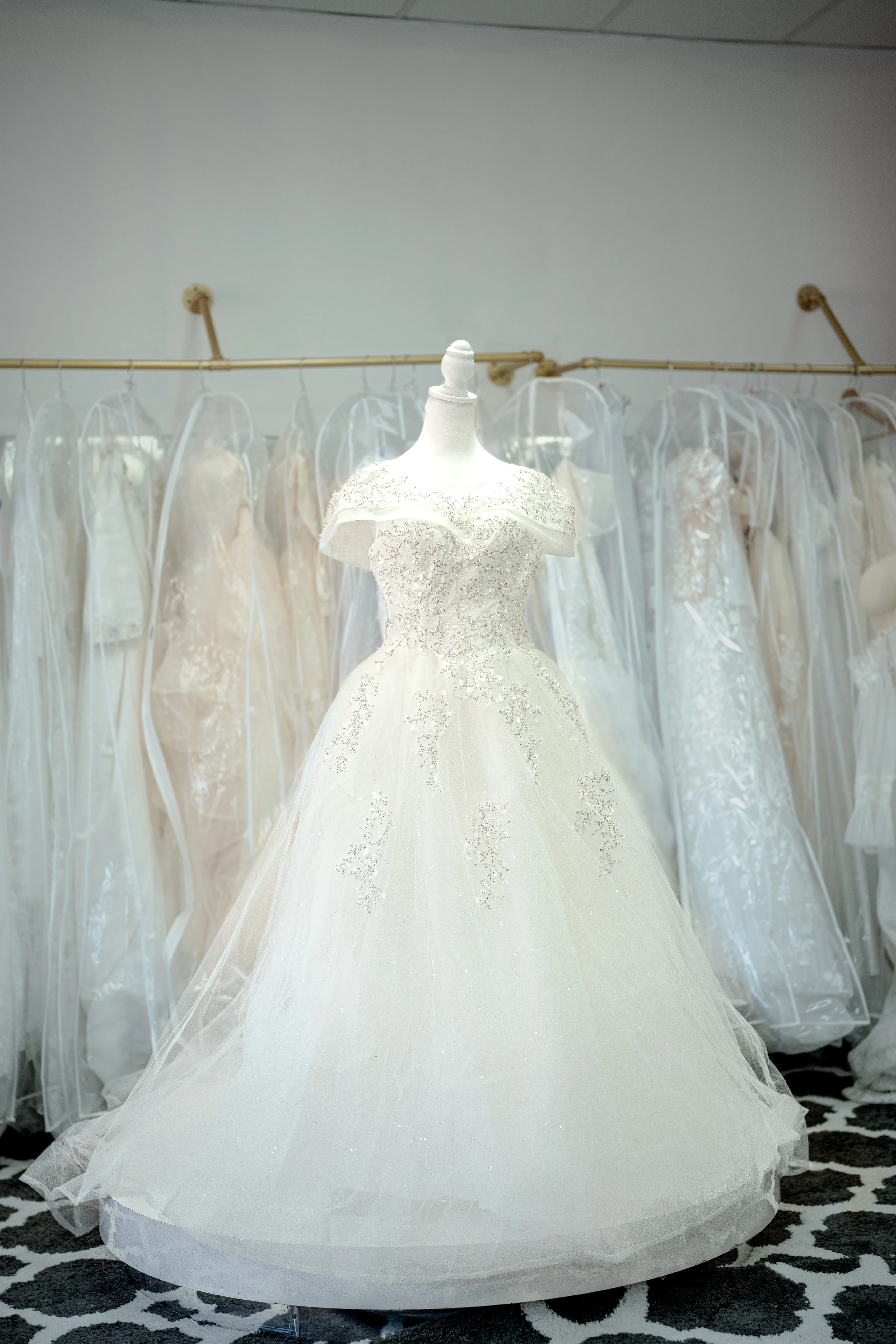 White off-shoulder floral lace wedding gown